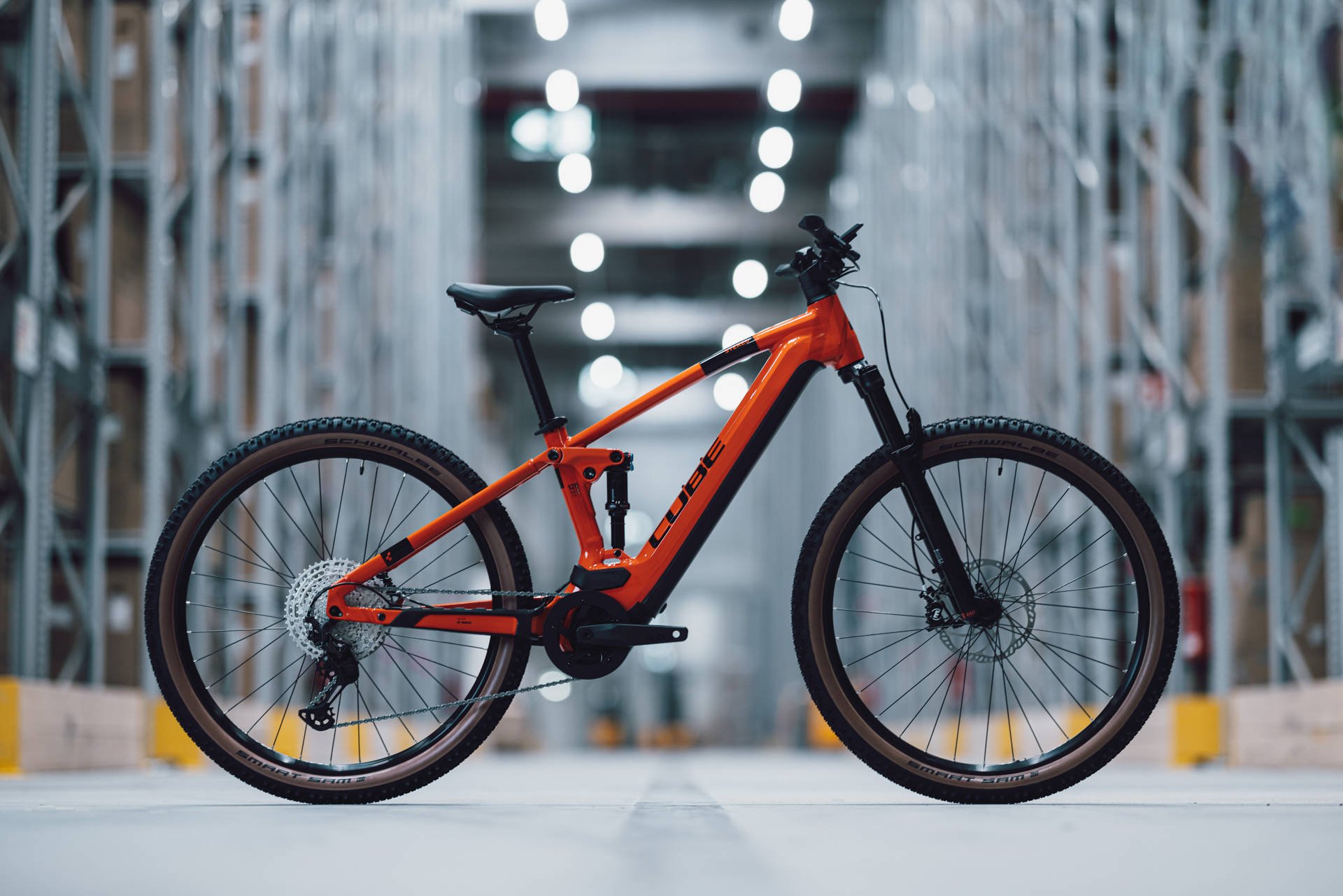 2024 Cube Stereo Hybrid 120 Race 750 Electric Full Suspension Mountain Bike In Spark Orange Scenic Shot 1