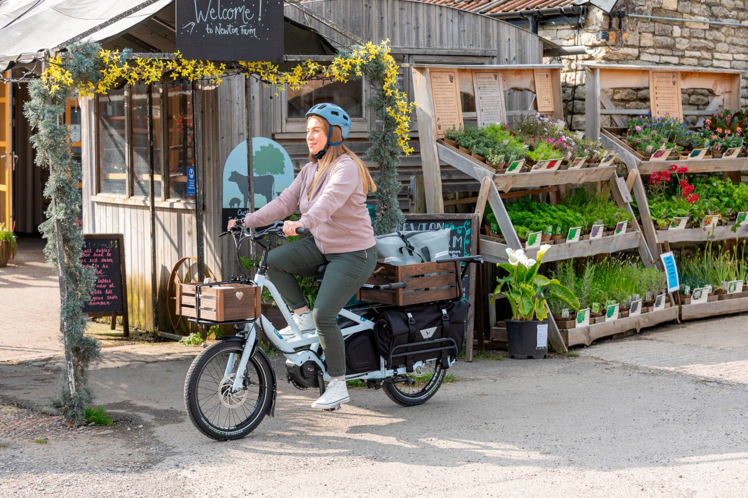 2024 Tern Quick Haul Long D9 Electric Cargo Bike In Satin Black Action Shot 1