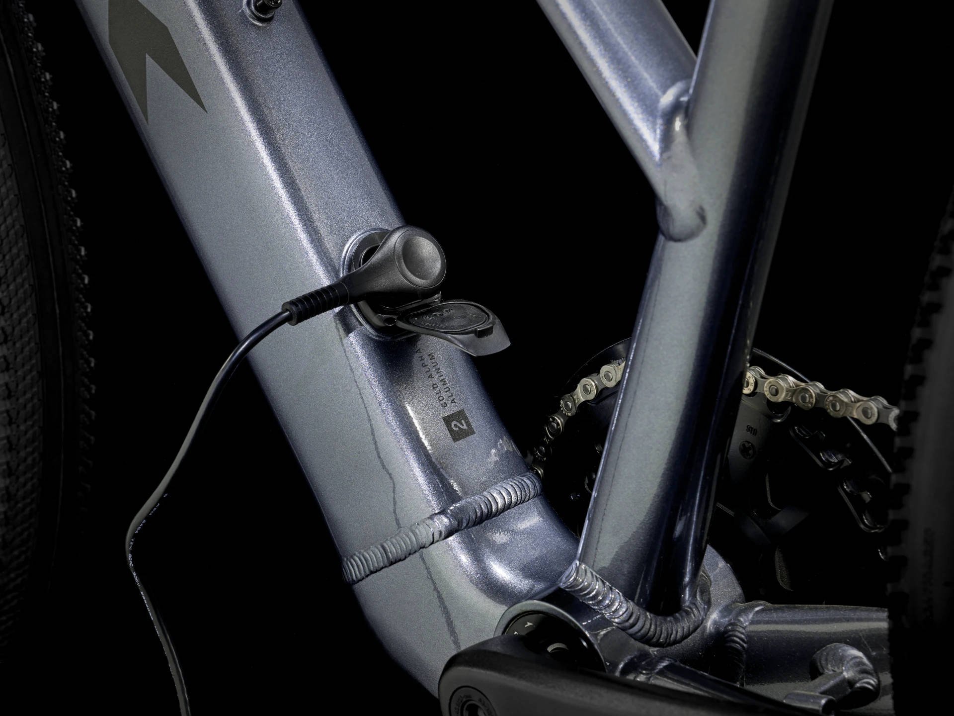 2025 Trek Dual Sport+ 2 Mid-Step LT Hub Motor Electric Bike In Galactic Grey Charging