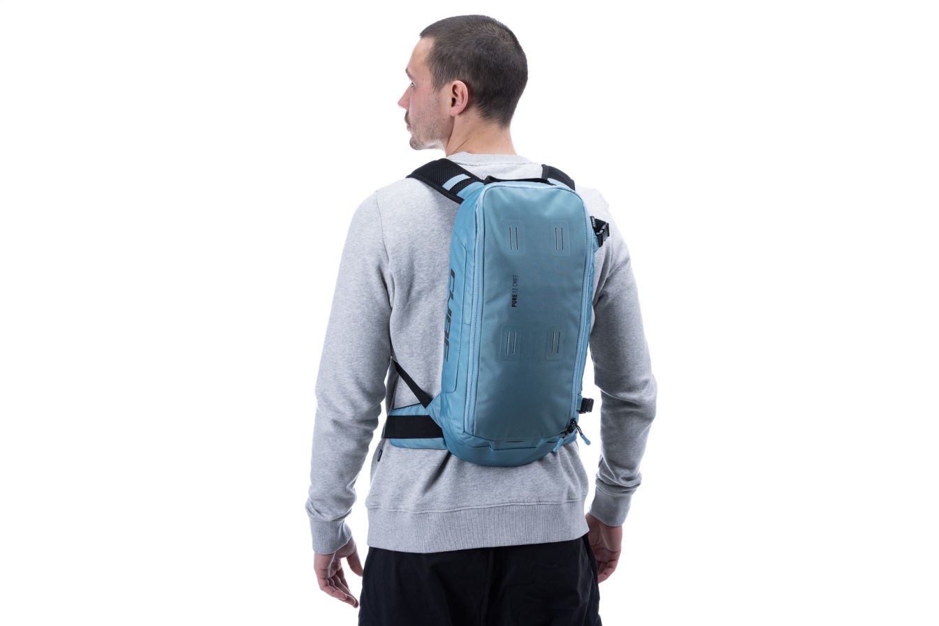 Cube Pure 12 CMPT Backpack - 12 Litres In Blue Action Shot 1
