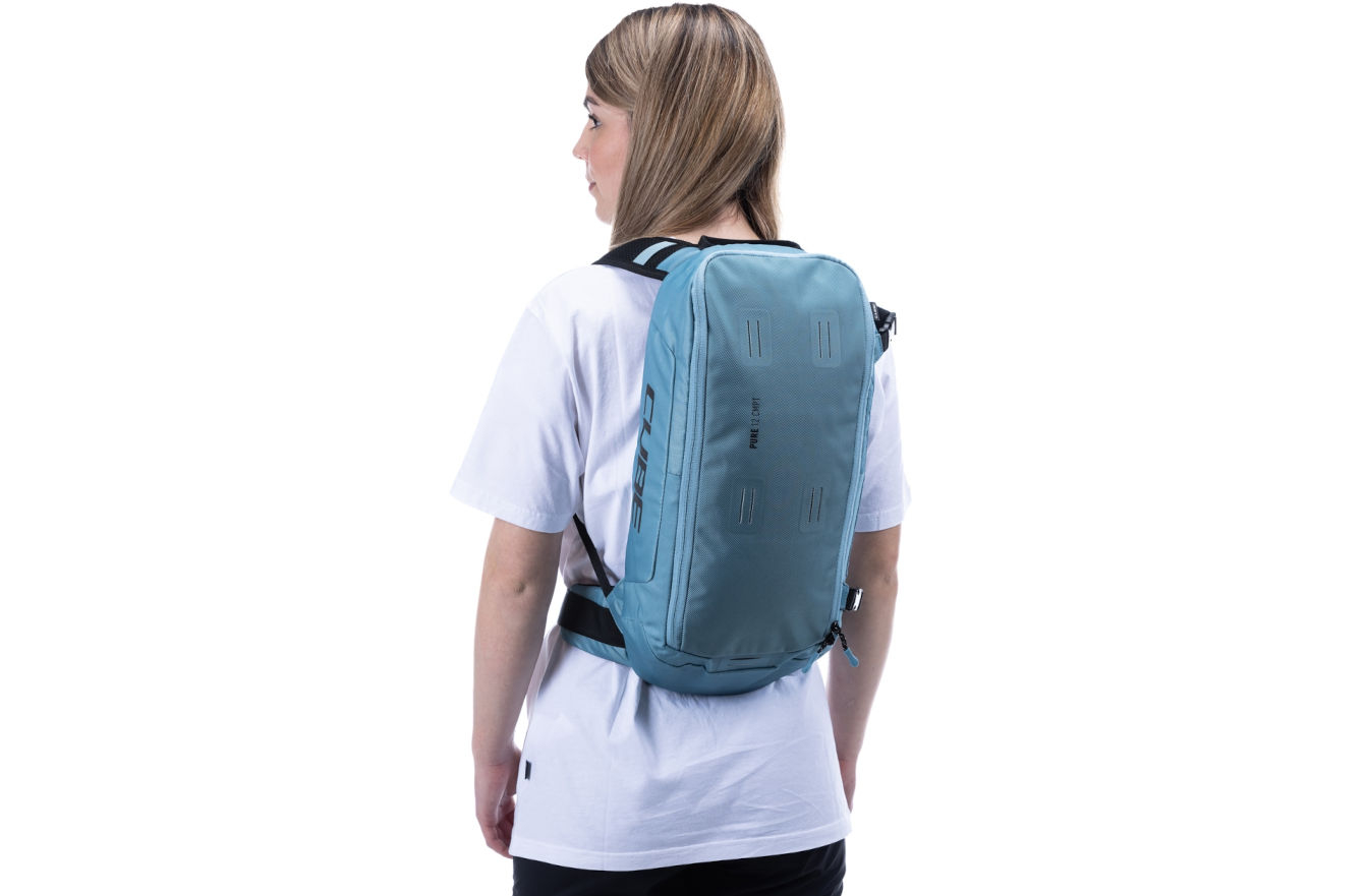Cube Pure 12 CMPT Backpack - 12 Litres In Blue Action Shot 2