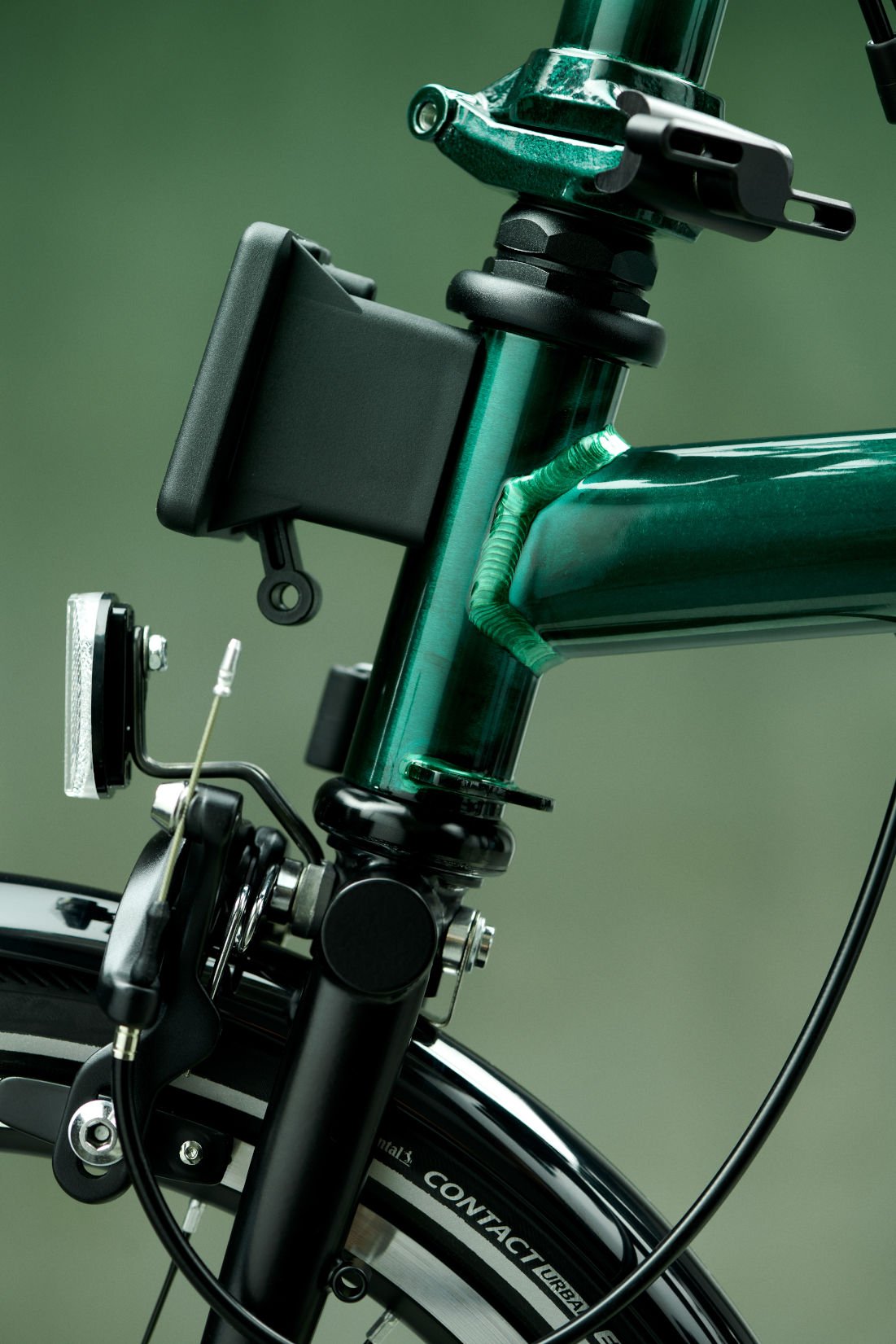 New Season Colour 2023 Brompton Electric P Line Urban 23 Mid Electric Folding Bike In Emerald Lacquer Fork Stem Close Up View